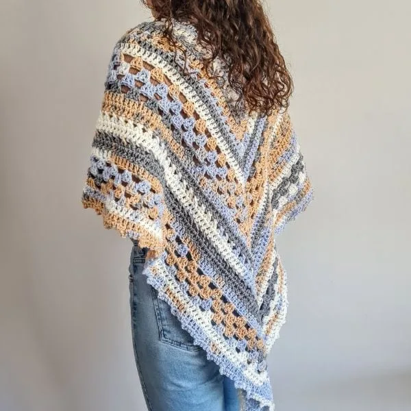 Nordic Trails crochet shawl draped over the shoulders, finished project