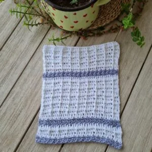 White and blue crochet dishcloth worked in a front post stitch