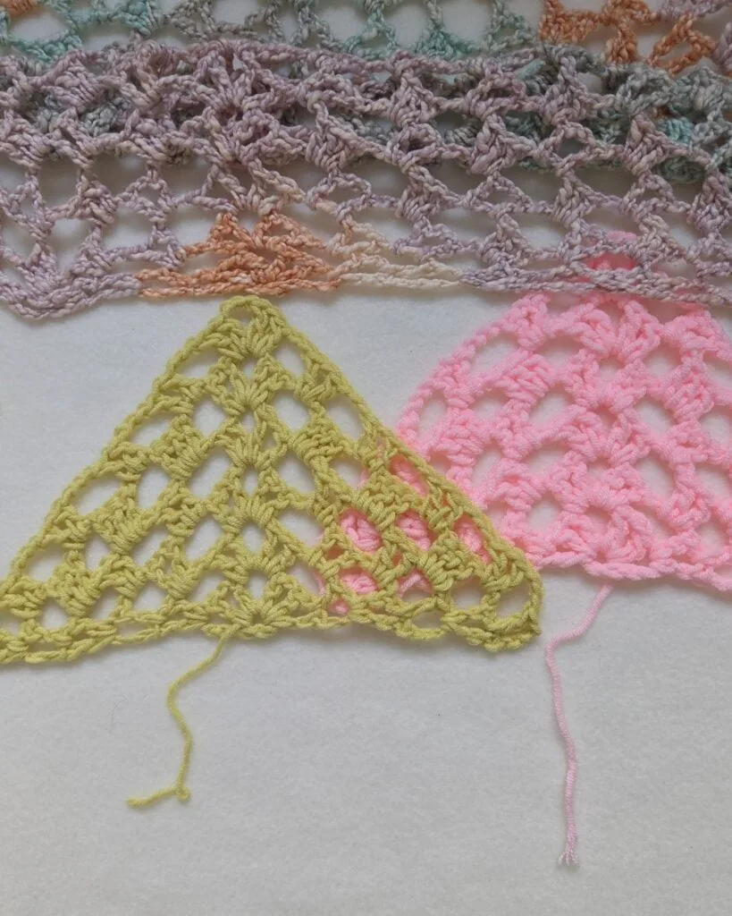 Lavender variegated crochet triangle shawl draped over a chair, a free crochet shawl for women over 55