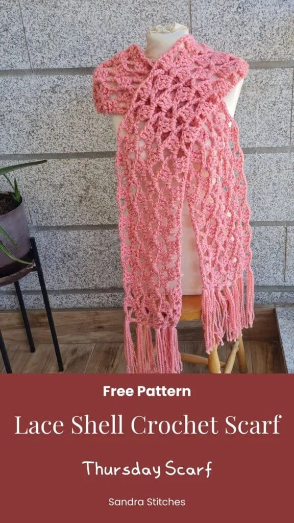Pinterest pin for the Thursday Scarf, a lacy crochet scarf with fringe in coral pink