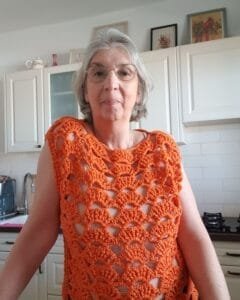 Valencia Top โ Fan-stitch crochet summer top in orange styled as a beach cover-up