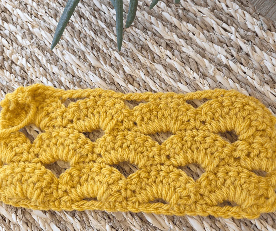 Crochet arcade stitch swatch showing rows of open fan shapes